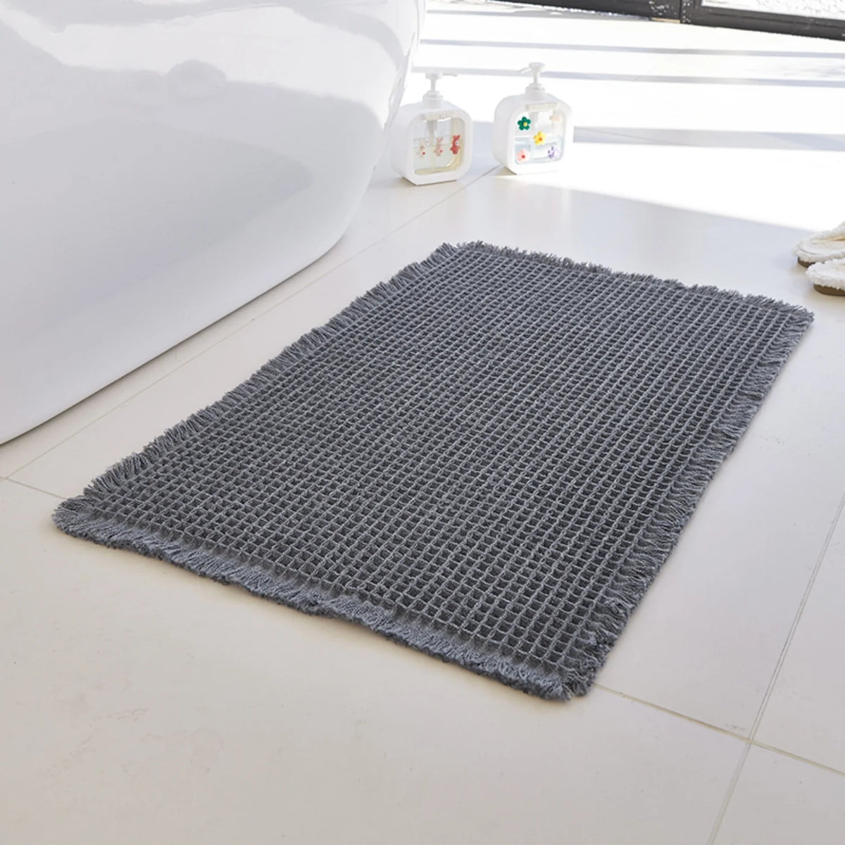 Tapis de bain nid d'abeille à franges