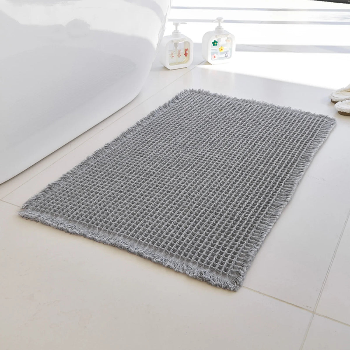 Tapis de bain nid d'abeille à franges